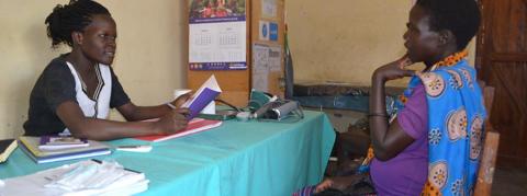 Caroline Akello attending to a mother at Loktelabu Health Centre III