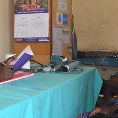 Caroline Akello attending to a mother at Loktelabu Health Centre III